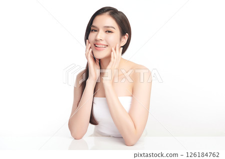 A beautiful young Asian woman with clean, fresh skin against a white background. Skincare, facial treatment, cosmetology, beauty, and spa. An elegant portrait of an Asian woman. A beautiful young Asian woman with clean, fresh skin against a white background. Skincare, facial treatment, cosmetology, beauty, and spa. An elegant portrait of an Asian woman. 126184762