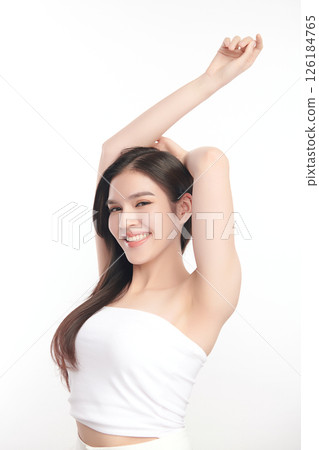 Beautiful Young Asian woman Raises her hands to Showcase clean and hygienic underarms Against a white background, Smooth armpit cleanliness and protection concept Beautiful Young Asian woman Raises her hands to Showcase clean and hygienic underarms Against a white background, Smooth armpit cleanliness and protection concept 126184765