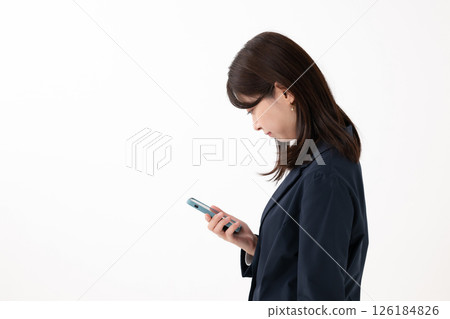 Woman operating a smartphone 126184826