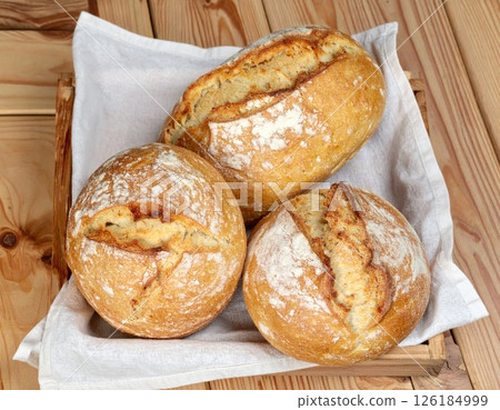 Three Sourdough Breads on a White Cloth Three Sourdough Breads on a White Cloth 126184999