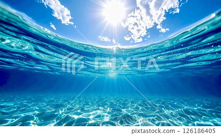 Transparent blue water with sunlight shining through Transparent blue water with sunlight shining through 126186405