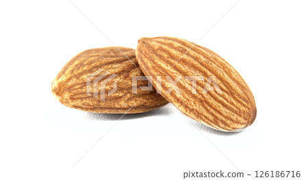 Two almonds, showcasing their textured surfaces and natural brown color, sit on a white background. 126186716