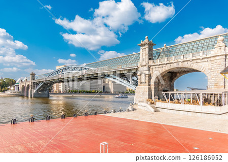 View of the Moscow river embankment, Pushkinsky bridge and cruise ships at sunset. 126186952