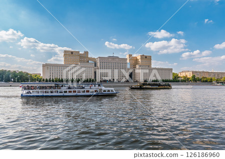 View of the Ministry of Defence of Russian Federation, and Moscow river embankment with cruise ships at sunset. 126186960
