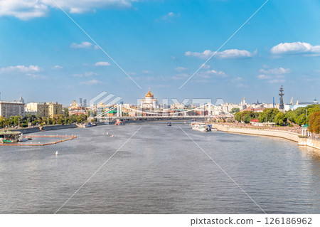 Cruise ship sails on the Moscow river in Moscow city center, popular place for walking. 126186962
