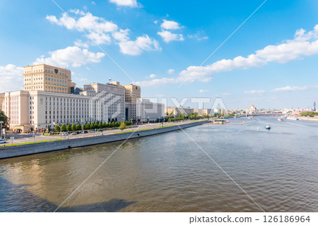 View of the Ministry of Defence of Russian Federation, and Moscow river embakment with cruise ships at sunset. 126186964