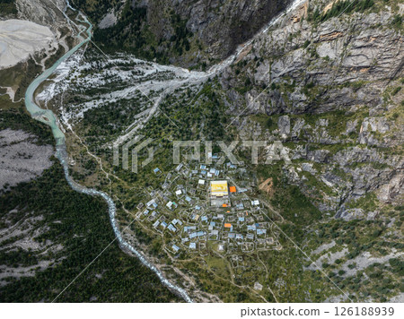 Aerial view of beautiful high altitude forest canyon and snow capped mountain landscape 126188939