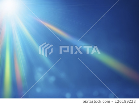 彩虹色的光芒從藍色背景上方照射進來 彩虹色的光芒從藍色背景上方照射進來 126189228