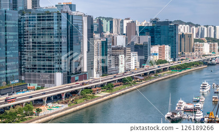 May 11 2025 Modern Urban Cityscape with Elevated Road and Waterfront View May 11 2025 Modern Urban Cityscape with Elevated Road and Waterfront View 126189266