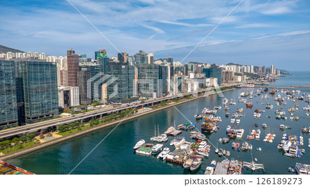 May 11 2025 Modern Urban Cityscape with Elevated Road and Waterfront View 126189273