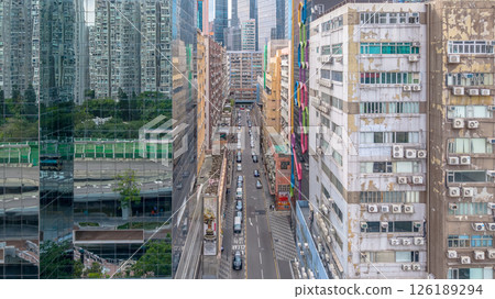 May 11 2025 Street Scene with High-Rise Buildings and Traffic in a Bustling City May 11 2025 Street Scene with High-Rise Buildings and Traffic in a Bustling City 126189294