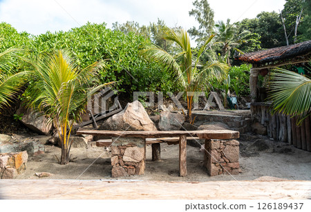 Rustic beach bar on a secluded shore of La Digue Island, Seychelles 126189437
