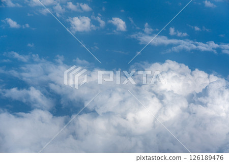 Blue Sky with White Clouds, Flying above Sunny Cloudy Sky Texture Pattern Plane View Blue Sky with White Clouds, Flying above Sunny Cloudy Sky Texture Pattern Plane View 126189476