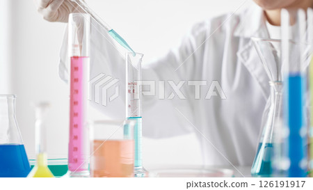 Hands Performing Scientific Experiments in a Modern Laboratory Setting. Hands Performing Scientific Experiments in a Modern Laboratory Setting. 126191917