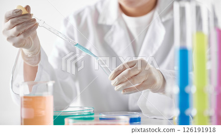 Hands Performing Scientific Experiments in a Modern Laboratory Setting. 126191918