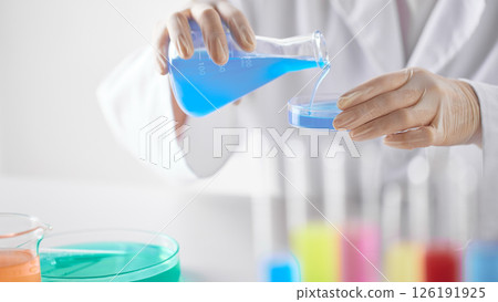 Hands Performing Scientific Experiments in a Modern Laboratory Setting. Hands Performing Scientific Experiments in a Modern Laboratory Setting. 126191925