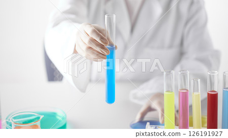 Hands Performing Scientific Experiments in a Modern Laboratory Setting. Hands Performing Scientific Experiments in a Modern Laboratory Setting. 126191927