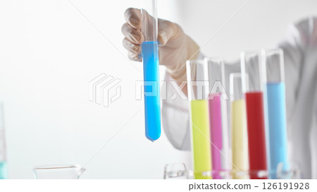 Hands Performing Scientific Experiments in a Modern Laboratory Setting. Hands Performing Scientific Experiments in a Modern Laboratory Setting. 126191928