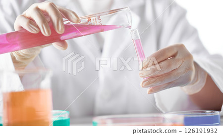 Hands Performing Scientific Experiments in a Modern Laboratory Setting. 126191932