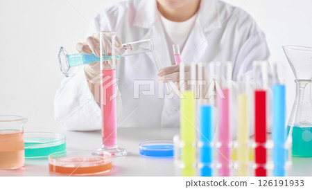 Hands Performing Scientific Experiments in a Modern Laboratory Setting. Hands Performing Scientific Experiments in a Modern Laboratory Setting. 126191933