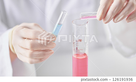 Hands Performing Scientific Experiments in a Modern Laboratory Setting. 126191936