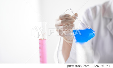 Hands Performing Scientific Experiments in a Modern Laboratory Setting. Hands Performing Scientific Experiments in a Modern Laboratory Setting. 126191937