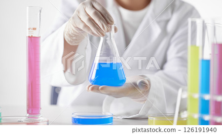 Hands Performing Scientific Experiments in a Modern Laboratory Setting. 126191940