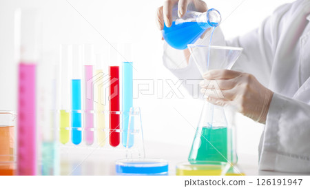 Hands Performing Scientific Experiments in a Modern Laboratory Setting. 126191947