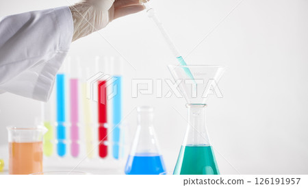 Hands Performing Scientific Experiments in a Modern Laboratory Setting. Hands Performing Scientific Experiments in a Modern Laboratory Setting. 126191957