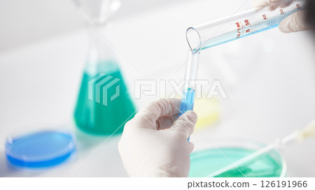 Hands Performing Scientific Experiments in a Modern Laboratory Setting. 126191966