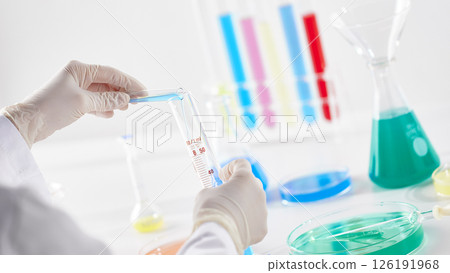 Hands Performing Scientific Experiments in a Modern Laboratory Setting. 126191968