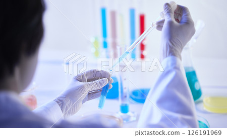 Hands Performing Scientific Experiments in a Modern Laboratory Setting. 126191969