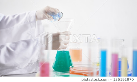 Hands Performing Scientific Experiments in a Modern Laboratory Setting. 126191970