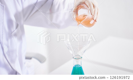 Hands Performing Scientific Experiments in a Modern Laboratory Setting. 126191972