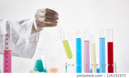 Hands Performing Scientific Experiments in a Modern Laboratory Setting. 126191975