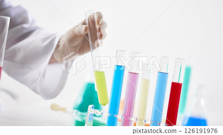 Hands Performing Scientific Experiments in a Modern Laboratory Setting. Hands Performing Scientific Experiments in a Modern Laboratory Setting. 126191976