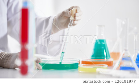 Hands Performing Scientific Experiments in a Modern Laboratory Setting. Hands Performing Scientific Experiments in a Modern Laboratory Setting. 126191977