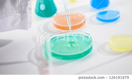Hands Performing Scientific Experiments in a Modern Laboratory Setting. Hands Performing Scientific Experiments in a Modern Laboratory Setting. 126191979