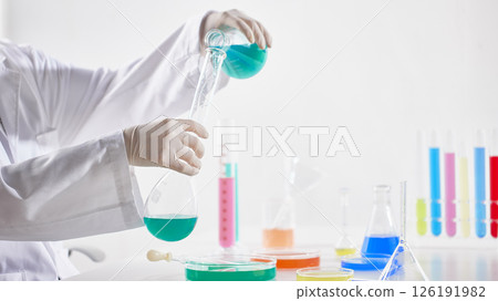 Hands Performing Scientific Experiments in a Modern Laboratory Setting. 126191982