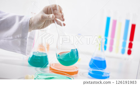 Hands Performing Scientific Experiments in a Modern Laboratory Setting. Hands Performing Scientific Experiments in a Modern Laboratory Setting. 126191983