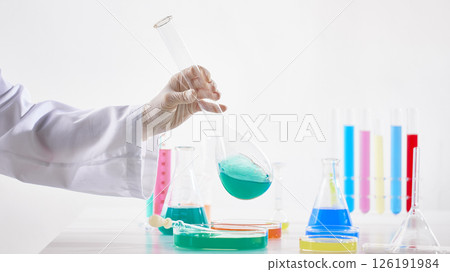 Hands Performing Scientific Experiments in a Modern Laboratory Setting. 126191984