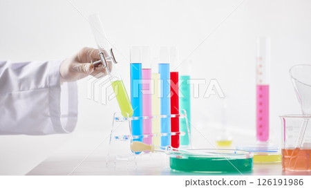 Hands Performing Scientific Experiments in a Modern Laboratory Setting. Hands Performing Scientific Experiments in a Modern Laboratory Setting. 126191986
