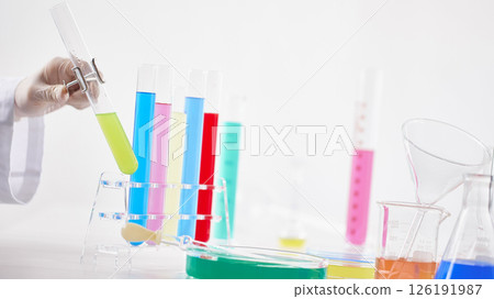 Hands Performing Scientific Experiments in a Modern Laboratory Setting. Hands Performing Scientific Experiments in a Modern Laboratory Setting. 126191987