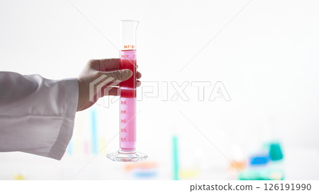 Hands Performing Scientific Experiments in a Modern Laboratory Setting. 126191990