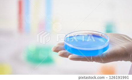 Hands Performing Scientific Experiments in a Modern Laboratory Setting. 126191991