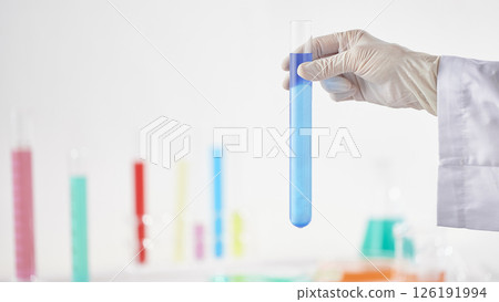 Hands Performing Scientific Experiments in a Modern Laboratory Setting. Hands Performing Scientific Experiments in a Modern Laboratory Setting. 126191994