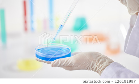 Hands Performing Scientific Experiments in a Modern Laboratory Setting. 126191997