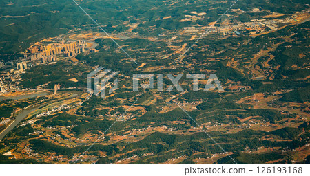 View From Airplane Window On Suburb Of Chengdu, China. Mountainous Landscape Of China. Porthole View Or Called Bull's-eye Window. Discover China. Chengdu Is Capital City Of Chinese Province Of Sichuan View From Airplane Window On Suburb Of Chengdu, China. Mountainous Landscape Of China. Porthole View Or Called Bull's-eye Window. Discover China. Chengdu Is Capital City Of Chinese Province Of Sichuan 126193168