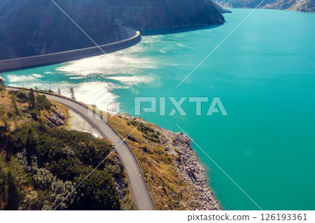 View from above of the mountain lake Kolnbreinspeicher in autumn and the Kolnbrein dam. Gamskarnock, Austria Europe 126193361