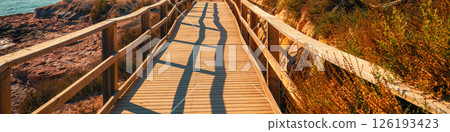 A wooden platform on the beach. Horizontal banner A wooden platform on the beach. Horizontal banner 126193423